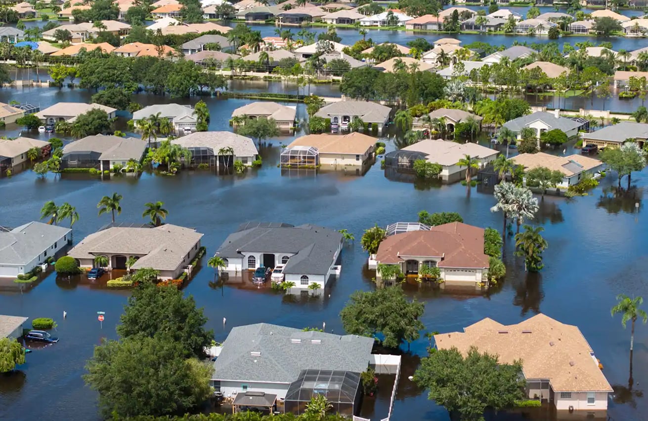 Water Infrastructure Vulnerability in Residential Areas Flooded residential neighborhood illustrating risk to water infrastructure and the built environment
