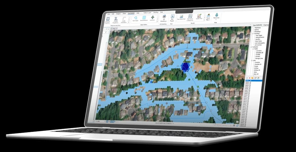 GeoSWMM software interface on laptop